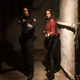 Avan Jogia and Kaya Scodelario aim guns as Leon S. Kennedy and Claire Redfield in Resident Evil: Welcome to Raccoon City.